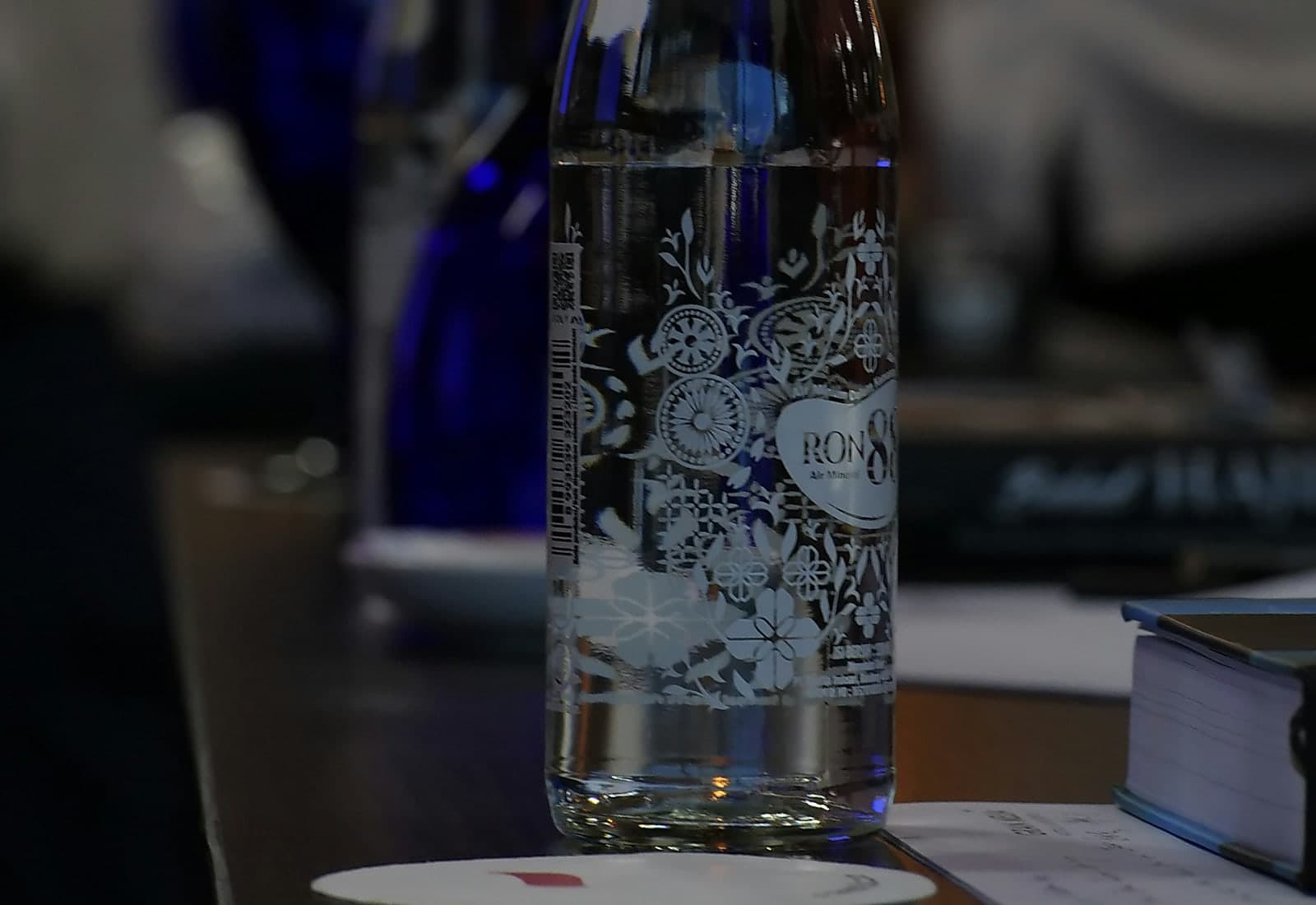Drinking water on a table symbolising hydration, heat health and daily wellbeing