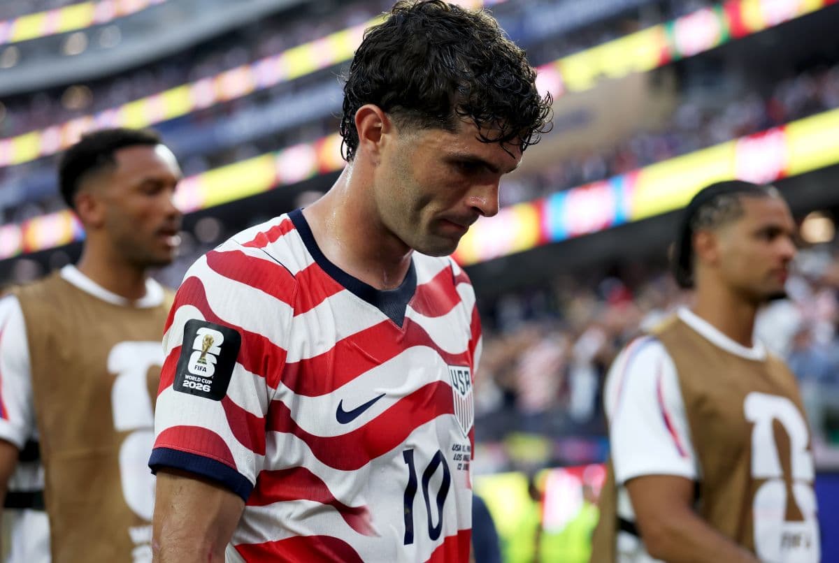 Christian Pulisic in an AC Milan kit, poised for a match as transfer rumours swirl around a potential MLS move